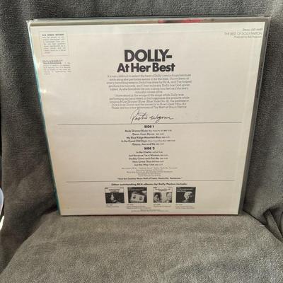 Sale Photo Thumbnail #243: "The Best of Dolly Parton", a compilation album by American singer-songwriter Dolly Parton. 
Key details about the album:
Release Date: November 9, 1970, released by RCA Victor.
Catalog Number: LSP-4445, as seen on the album cover [OCR text].
Content: The