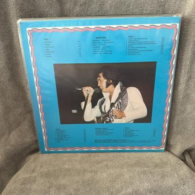 Sale Photo Thumbnail #219: "Rockin' With Elvis New Year's Eve," a deluxe 2-record set featuring Elvis Presley's concert performance in Pittsburgh, PA, on December 31, 1976. 
Here are some details about this album:
Concert Details: The album captures Elvis Presley's iconic New Year'