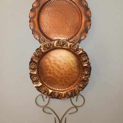 GREGORIAN COPPER PLATTERS AND A WALL HUNG PLATE HOLDER