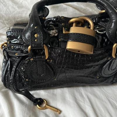 Sale Photo Thumbnail #4: • iconic 2000s / 2010s chloe paddington shoulder bag ???
• in lovely condition
• signs of wear on the hardware
• functional padlock
• can fit so much inside
• bag is literally to die for & the pics do not do it justice
• patent black
• sou