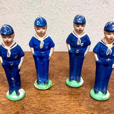 Sale Photo Thumbnail #31: Set of 4 Cub Scout figurines.  The one on the right end has been repaired, the head was glued back on (not very noticeable). Approx. 3” tall.