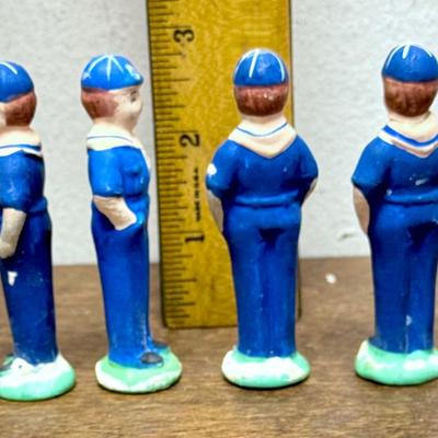 Sale Photo Thumbnail #35: Set of 4 Cub Scout figurines.  The one on the right end has been repaired, the head was glued back on (not very noticeable). Approx. 3” tall.