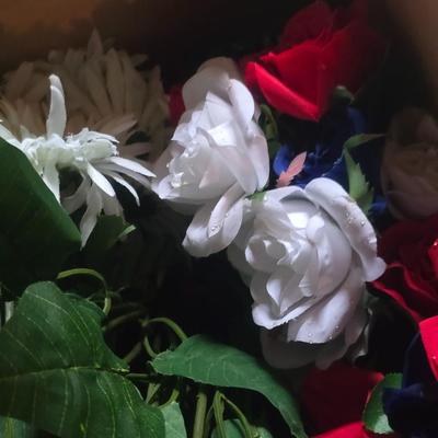 A BOX OF FAUX FLOWERS
