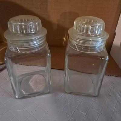 CERAMIC HOUSE HOT PLATE AND SEVERAL GLASS CANISTERS
