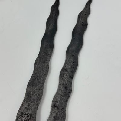 Sale Photo Thumbnail #27: 13” blade 9” shaft
Persian wavy two-pronged spearheads have been in use since the 16th Century. The majority of examples available today date back to the Qajar period. The base of the blade is decorated with chiseled ornate motifs along with small inl