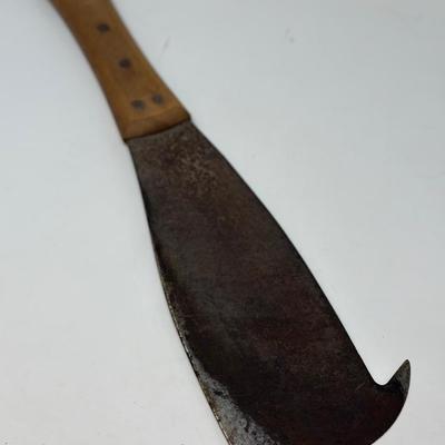 Sale Photo Thumbnail #34: Large hand welded cutting tool similar to a machete used for cutting sugar cane. 11 1/4” blade