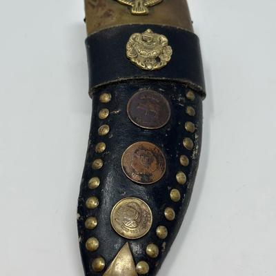 Sale Photo Thumbnail #54: Rare piece in excellent condition.  7” blade and hand carved wood handle
The Gurkha Kukri was commonly used as a weapon or in ceremonies. The blade features a cut-out right below the grip. It is said that it resembles Shiva, a cow's foot as a reminder n