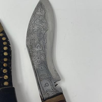 Sale Photo Thumbnail #50: Rare piece in excellent condition.  7” blade and hand carved wood handle
The Gurkha Kukri was commonly used as a weapon or in ceremonies. The blade features a cut-out right below the grip. It is said that it resembles Shiva, a cow's foot as a reminder n