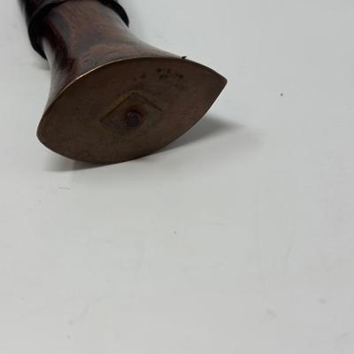 Sale Photo Thumbnail #52: Rare piece in excellent condition.  7” blade and hand carved wood handle
The Gurkha Kukri was commonly used as a weapon or in ceremonies. The blade features a cut-out right below the grip. It is said that it resembles Shiva, a cow's foot as a reminder n
