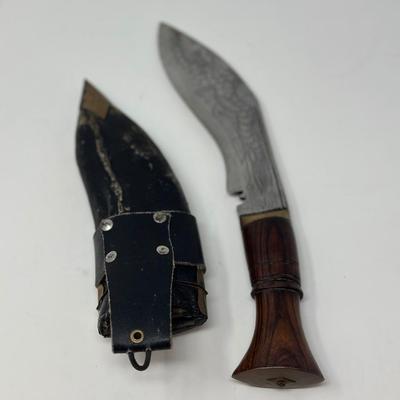 Sale Photo Thumbnail #53: Rare piece in excellent condition.  7” blade and hand carved wood handle
The Gurkha Kukri was commonly used as a weapon or in ceremonies. The blade features a cut-out right below the grip. It is said that it resembles Shiva, a cow's foot as a reminder n