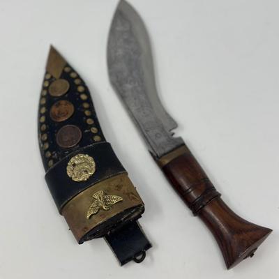 Sale Photo Thumbnail #47: Rare piece in excellent condition.  7” blade and hand carved wood handle
The Gurkha Kukri was commonly used as a weapon or in ceremonies. The blade features a cut-out right below the grip. It is said that it resembles Shiva, a cow's foot as a reminder n
