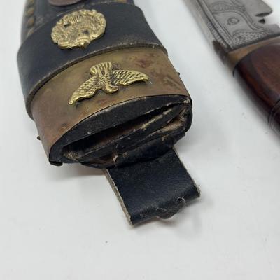 Sale Photo Thumbnail #48: Rare piece in excellent condition.  7” blade and hand carved wood handle
The Gurkha Kukri was commonly used as a weapon or in ceremonies. The blade features a cut-out right below the grip. It is said that it resembles Shiva, a cow's foot as a reminder n