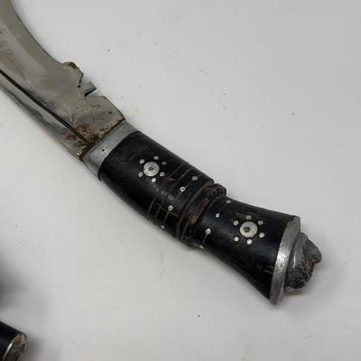 Sale Photo Thumbnail #56: Made in India. The blade is carbon steel and measures 11.06” long by 14.62” overall
The Gurkha Kukri was commonly used as a weapon or in ceremonies. The blade features a cut-out right below the grip. It is said that it resembles Shiva, a cow's foot as