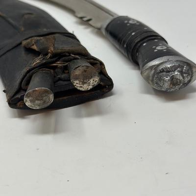 Sale Photo Thumbnail #62: Made in India. The blade is carbon steel and measures 11.06” long by 14.62” overall
The Gurkha Kukri was commonly used as a weapon or in ceremonies. The blade features a cut-out right below the grip. It is said that it resembles Shiva, a cow's foot as