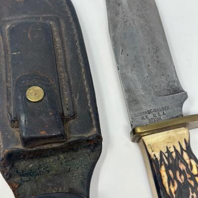 Sale Photo Thumbnail #97: Pro hunter fixed blade knife with birds head pommel and brass finger guard, c. 1971-72. Leather sheath 10 1/2” overall length