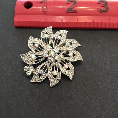 Sale Photo Thumbnail #12: Beautiful Silvertone brooch with AB rhinestones. Please see attached photos.