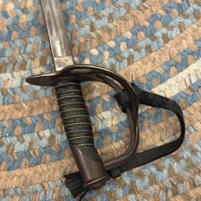 Sale Photo Thumbnail #111: Manufactured by the Ames sword company, the model 1906. Xavior was an updated model 1860 like Calvary Saber. The Saber has a 34 7/8 inch bright double fuller blade, with USJC restamped on the left ricasso and A.S. Co. above ordinance , shell and flame ins