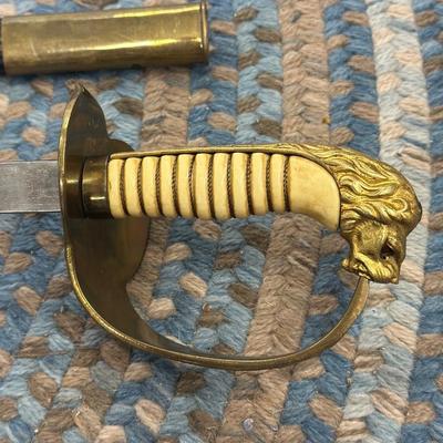Sale Photo Thumbnail #123: This is an original World War II Kriegsmarine  (Nazi Navy) sword.  These weren’t used in combat but rather for parades and a symbol of status. The sword is maker stamped by E. F. Horster. The scabbard is damaged as shown in photos.