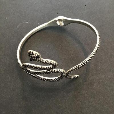 Sale Photo Thumbnail #84: Silvertone vintage, hinged snake bracelet. Please see attached photos.