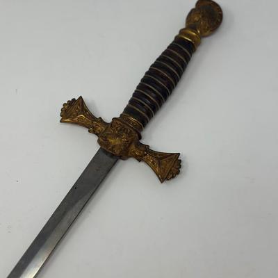 Sale Photo Thumbnail #126: C. 1800s, the blade near the hilt is etched The M.C. Likely & Co.  Columbus, O.  It is etched in the middle of the blade depicting 'LOOM' with a moose head. The skin grip is in nice condition. The blade measures 28 inches in length.