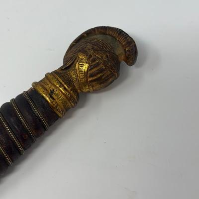 Sale Photo Thumbnail #130: C. 1800s, the blade near the hilt is etched The M.C. Likely & Co.  Columbus, O.  It is etched in the middle of the blade depicting 'LOOM' with a moose head. The skin grip is in nice condition. The blade measures 28 inches in length.