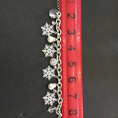 Sale Photo Thumbnail #112: Very nice Silver toned vintage Avon Christmas fashion statement bracelet. Please see attached photos.