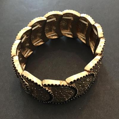 Sale Photo Thumbnail #158: Very nice hammered gold tone, stretchy bracelet. Please see attached photos.