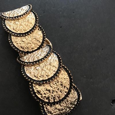 Sale Photo Thumbnail #157: Very nice hammered gold tone, stretchy bracelet. Please see attached photos.