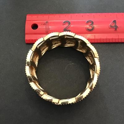 Sale Photo Thumbnail #156: Very nice hammered gold tone, stretchy bracelet. Please see attached photos.