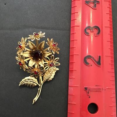 Beautiful, vintage, gold tone , flower, brooch, with red rhinestones