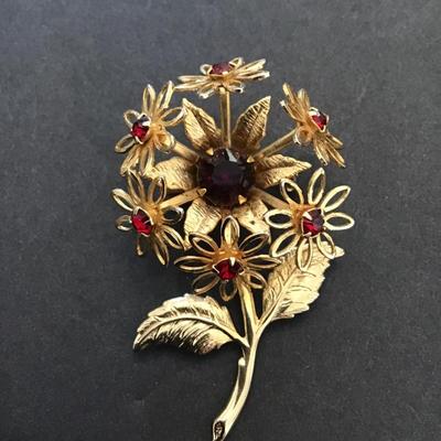 Beautiful, vintage, gold tone , flower, brooch, with red rhinestones