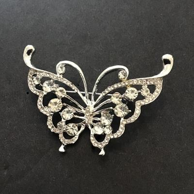 Silver toned butterfly brooch with rhinestones