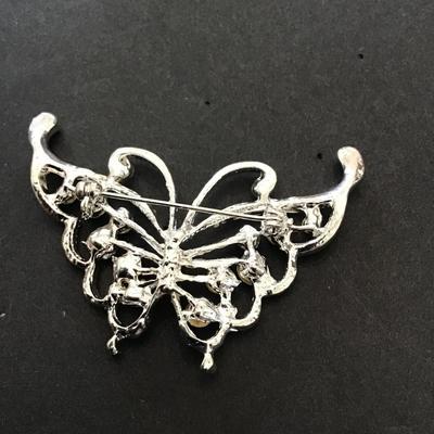 Silver toned butterfly brooch with rhinestones