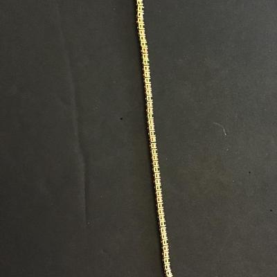 Beautiful, gold tone, tennis bracelet with multicolored rhinestones