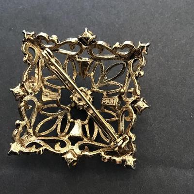 Vintage, JJ, gold toned brooch with red rhinestones