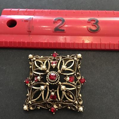 Vintage, JJ, gold toned brooch with red rhinestones