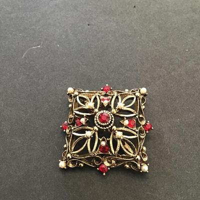 Vintage, JJ, gold toned brooch with red rhinestones