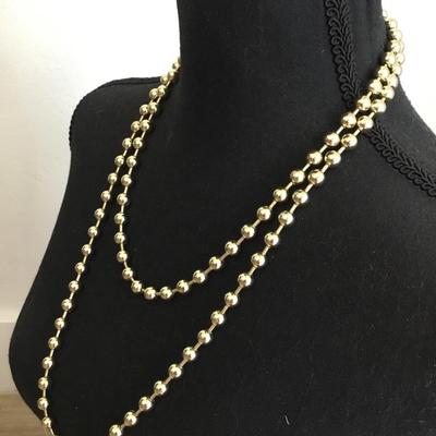 Vintage metal gold toned beaded necklace, long excellent condition very cool