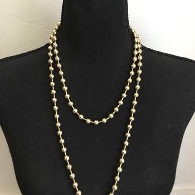 Vintage metal gold toned beaded necklace, long excellent condition very cool