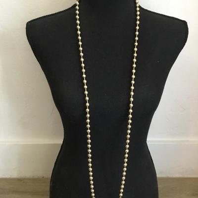 Vintage metal gold toned beaded necklace, long excellent condition very cool