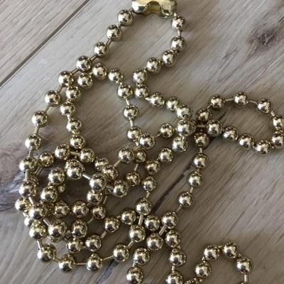 Vintage metal gold toned beaded necklace, long excellent condition very cool