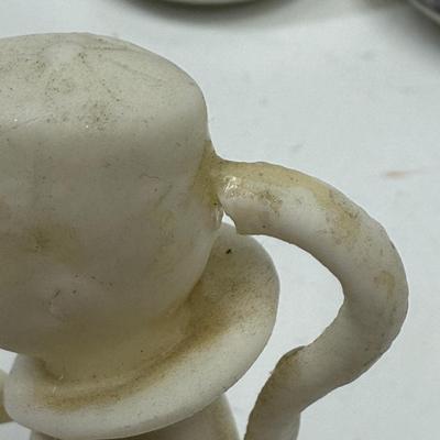 Sale Photo Thumbnail #169: In fair to good used condition. One of the figurines has been reglued on the back of head. And one saucer has small chip.