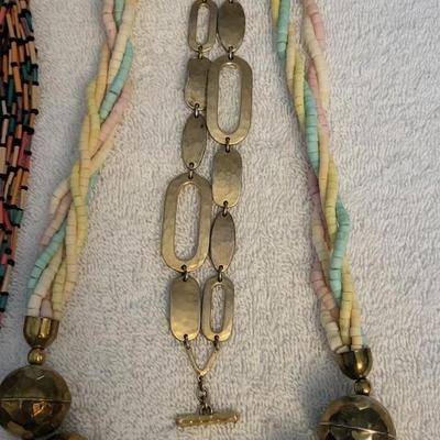 THREE NECKLACES AND A BRACELET