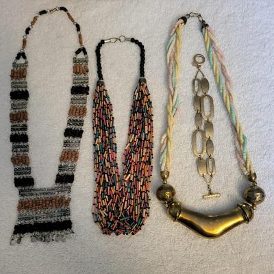 THREE NECKLACES AND A BRACELET