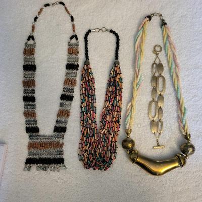 THREE NECKLACES AND A BRACELET