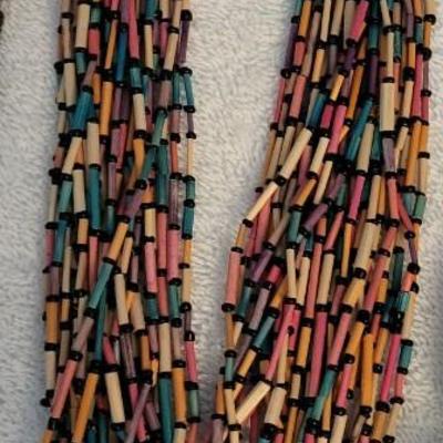 THREE NECKLACES AND A BRACELET