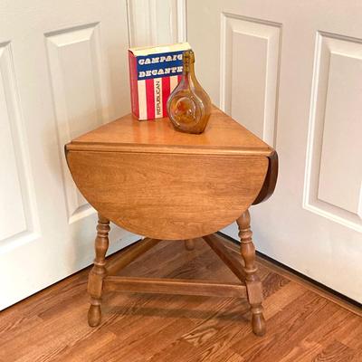 LOT 224: Tri-Fold Drop Leaf Wooden Accent Table with Wheaton Glass Martin Luther King and 1972 Republican Decorative Collectible Bottles