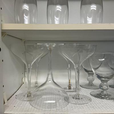 Sale Photo Thumbnail #1023: 7 blue stem champagne glasses, set of 5 blue goblets, 5 large dessert glasses, 5 toupe champagne glasses