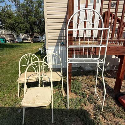 Three metal folding chairs and shelf for over the toilet