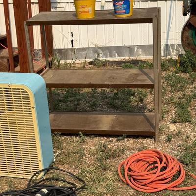 Two extension cords, small metal shelf and box fan